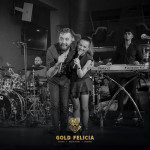 Black & white photo of Alter Ego Band having a concert in Gold Felicia Bitola